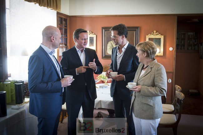 Reinfedlt, Cameron lecturing, Rutte and Merkel over coffee (credit: )