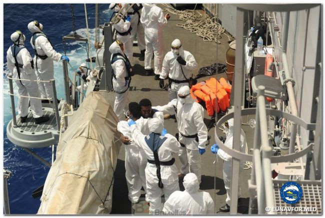 A survivor hugs his rescuers upon arrival on the Reina Sofia (credit: Eunavfor Med / Spanish Navy)