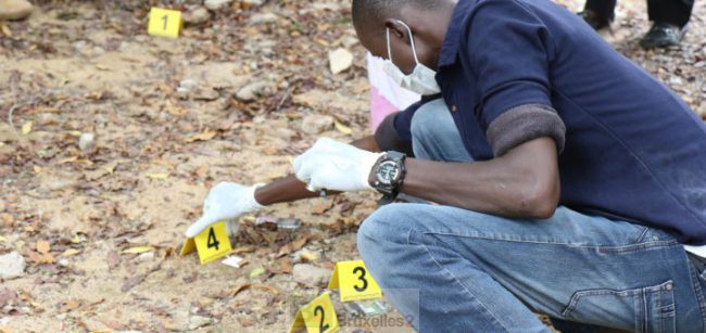 A Malian police officer places evidence markers at a crime scene. (EUCAP Sahel Mali)