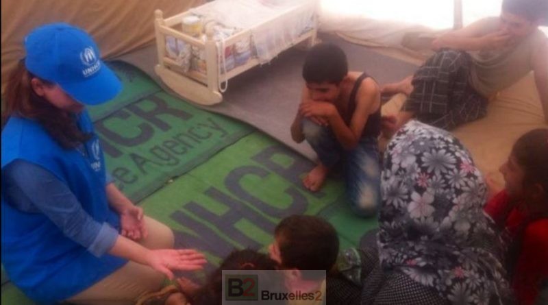 A UNHCR educator with a group of Syrian children. (UNHCR)